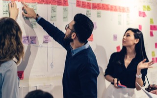 business-productivity:alt.A staff giving presentaton to his coworkers